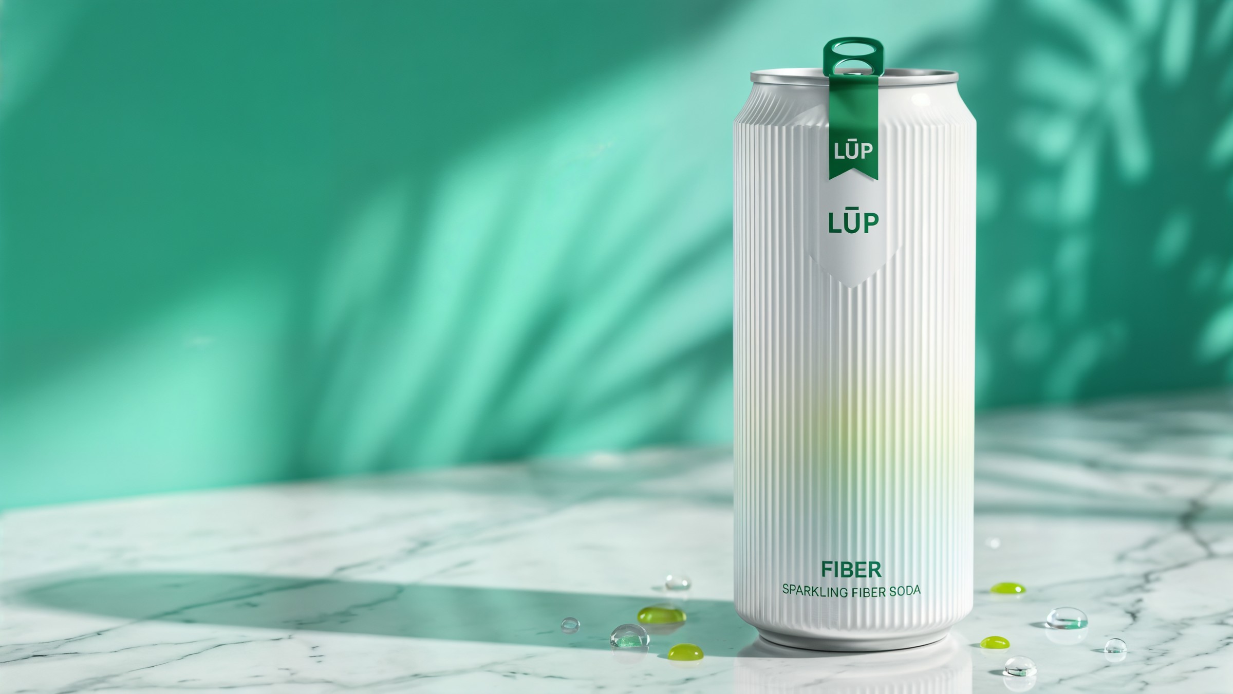 Fluted soda can on wet stone with citrus beside it